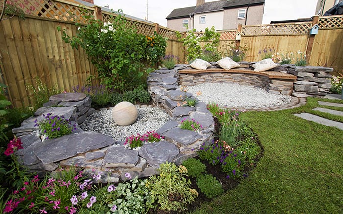 Love Your Garden finished make over seating area with stone walls and pebbles