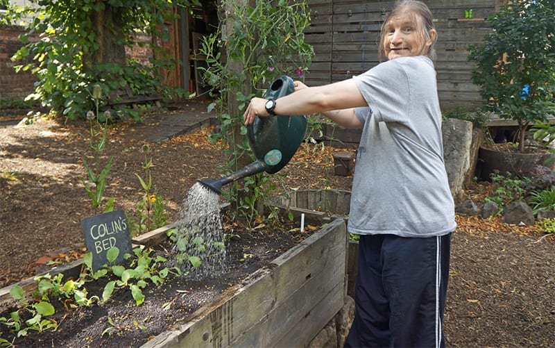 Colin watering a bed at Woodlands Community garden in Cultivation Street 2014 campaign winner