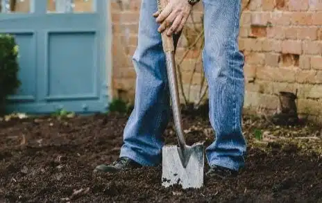 man digging for soil improvement